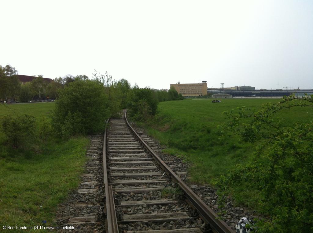 The railway siding goes further north to the airport building